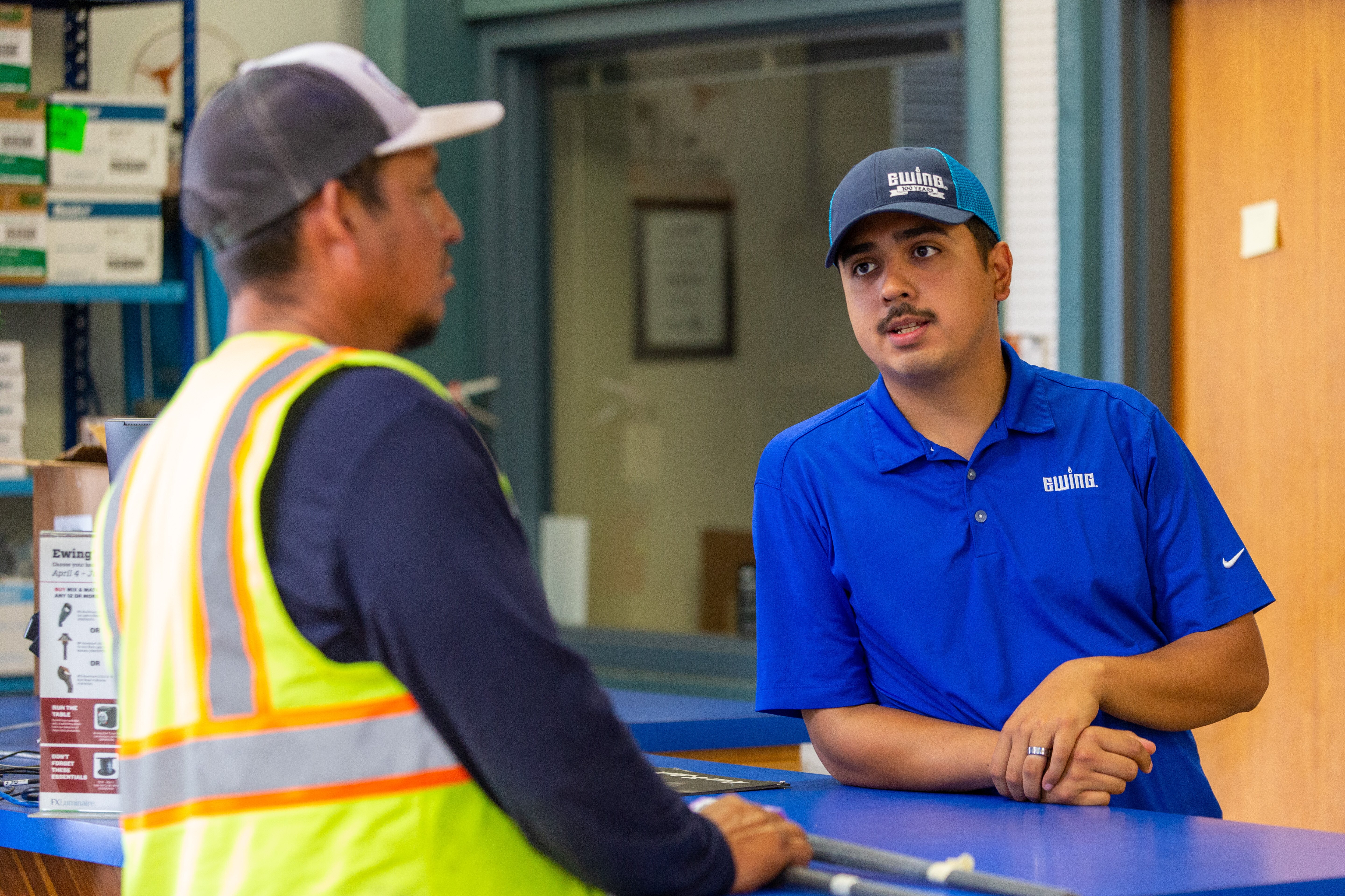 Ewing employee assisting a customer at the front counter (Photo taken by Kyle Ellsworth/Ewing Outdoor Supply)