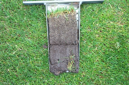 Cross-section of a golf course fairway showing layers of sand and soil