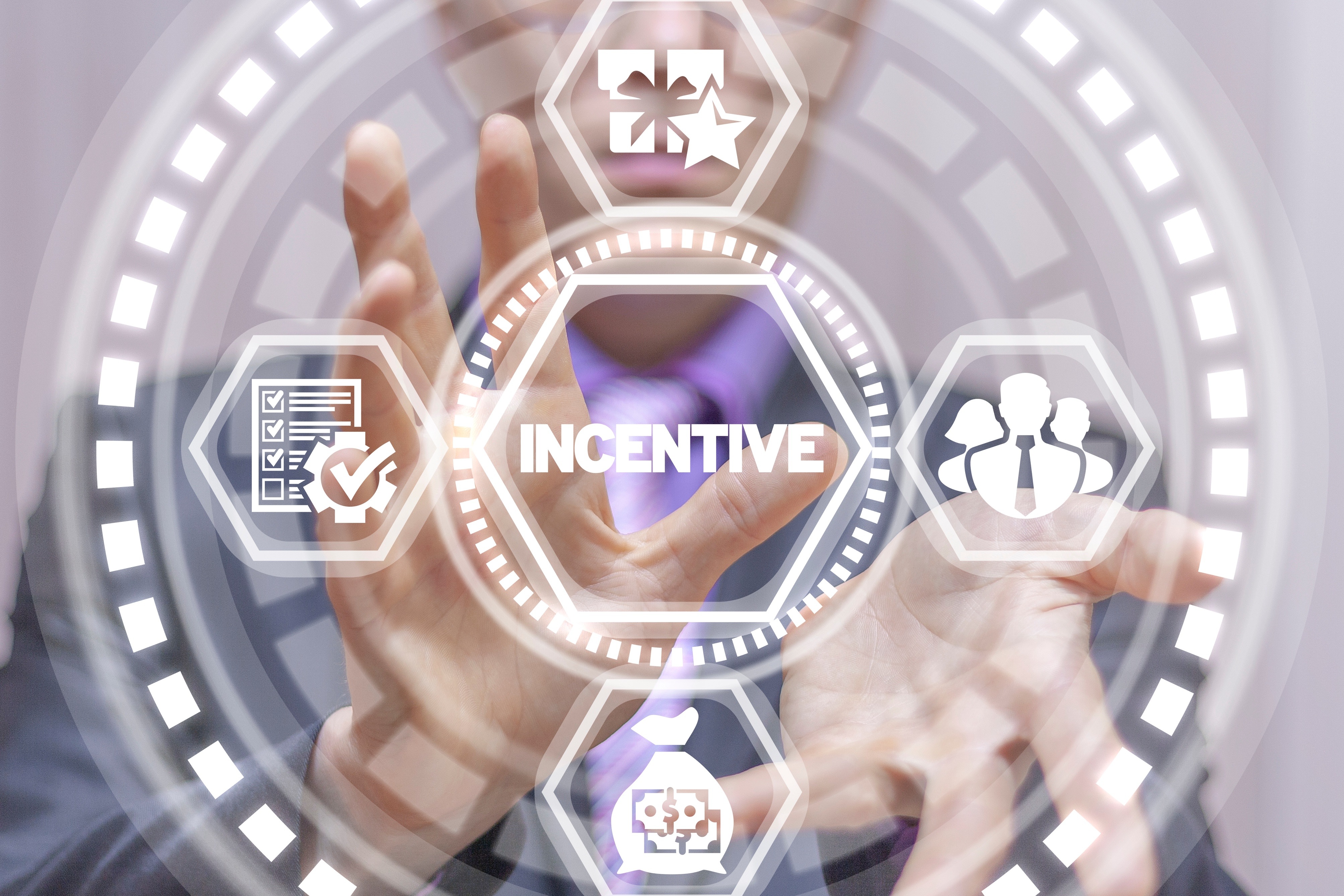 the word "Incentive" surrounded by icons representing rewards, checklists, people, and money, suggesting the concept of business incentives and rewards programs