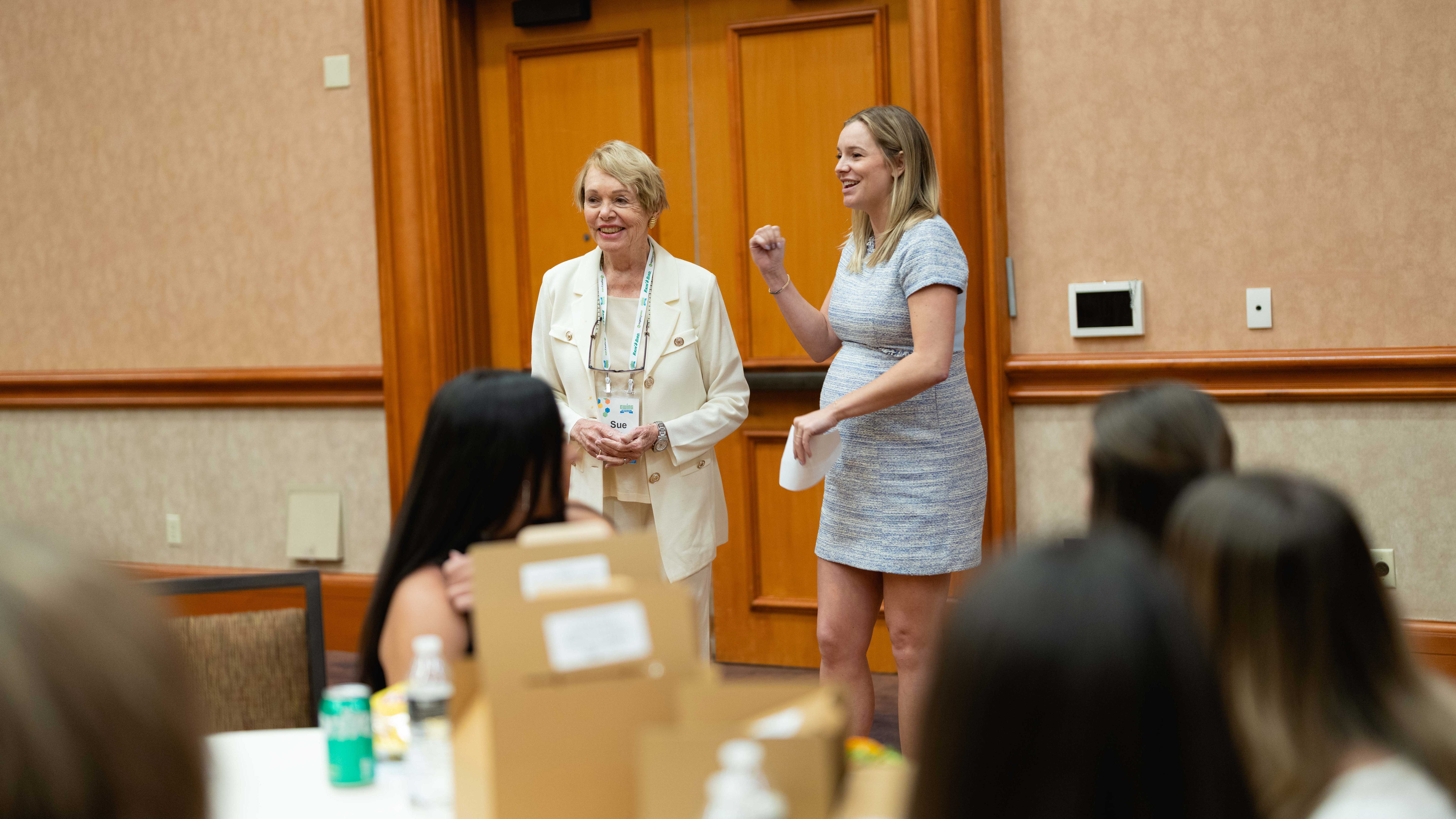 Allie York Tripaldi and her grandmother, Sue York, address attendees at Ewing’s Women’s Interest Group lunch during the company’s 100-year celebration in Las Vegas, May 2023.