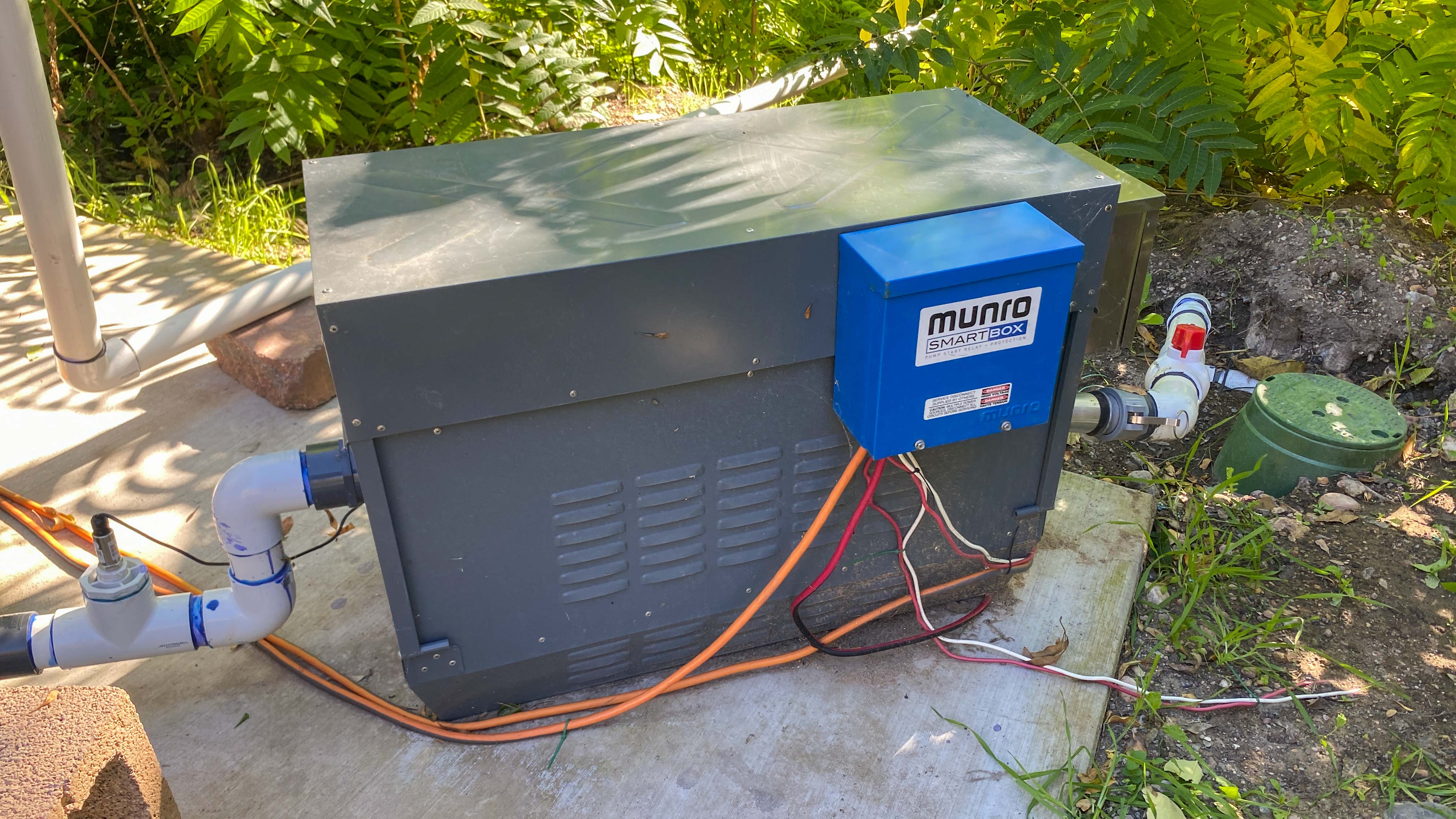 An irrigation pump electric box installed in a yard. 
