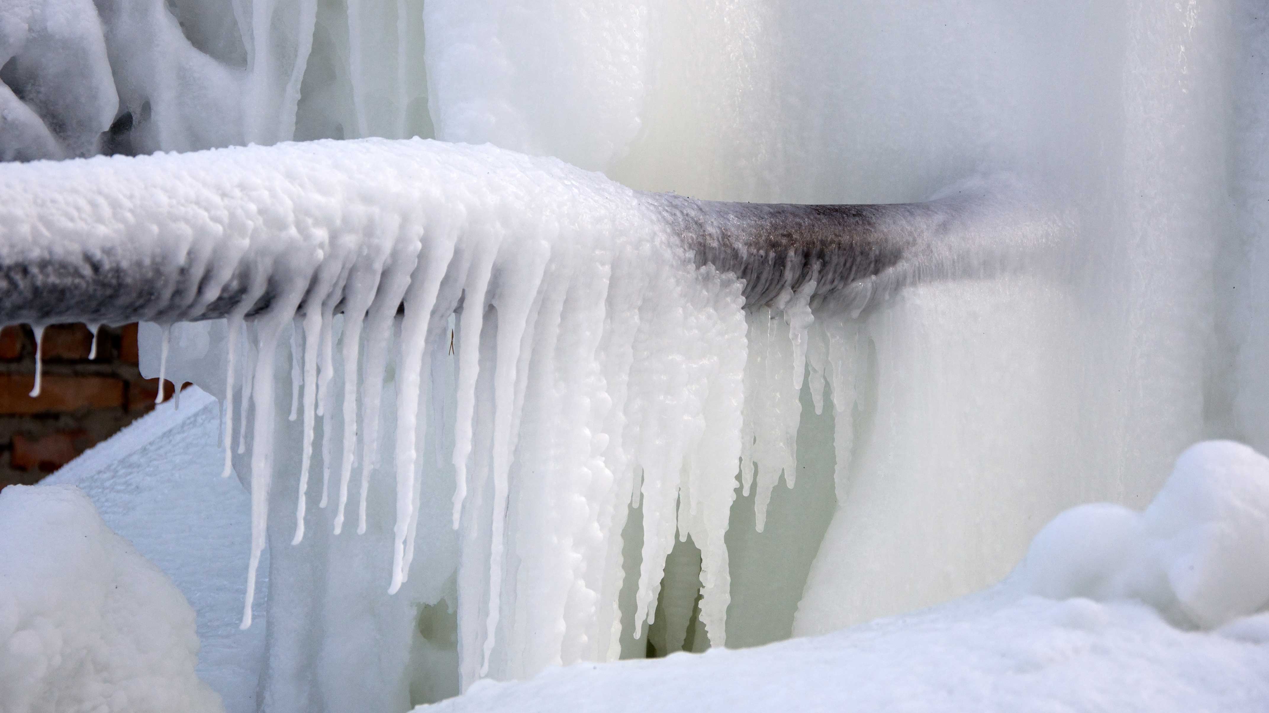 A picture of an irrigation pump covered in snow and ice. 